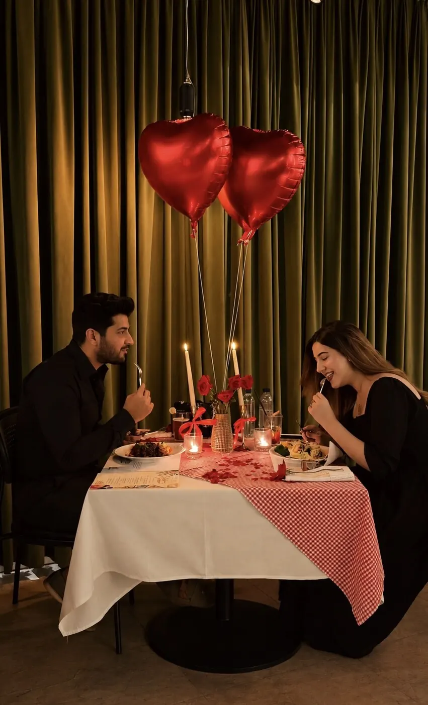 A couple at a candlelit table for two at Neapo