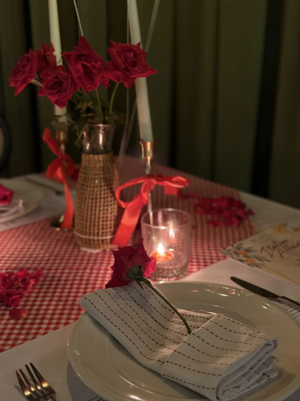Roses and a candle on the Date Club table